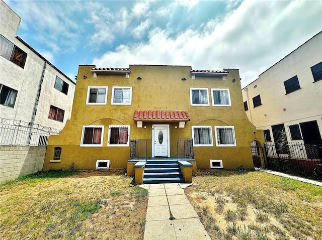 1136 Arapahoe St, Los Angeles, CA 90006 - view of property with a tiled roof and stucco siding