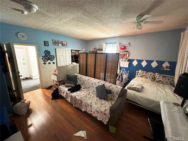 1136 Arapahoe St, Los Angeles, CA 90006 - bedroom with wood finished floors, a textured ceiling, and a ceiling fan