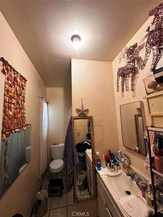 1136 Arapahoe St, Los Angeles, CA 90006 - full bathroom with tile patterned flooring, toilet, and vanity