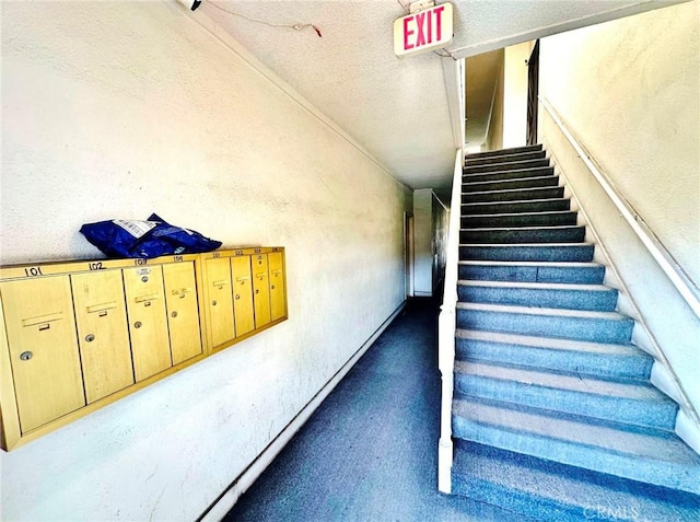 1136 Arapahoe St, Los Angeles, CA 90006 - stairs featuring a textured wall, a textured ceiling, carpet, and mail area
