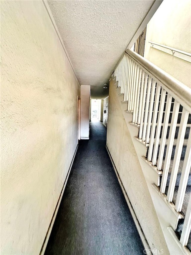 1136 Arapahoe St, Los Angeles, CA 90006 - corridor featuring a textured wall and a textured ceiling