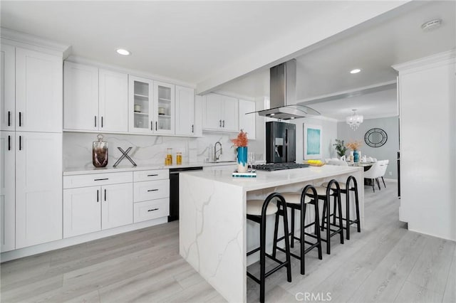 23064 Paseo De Terrado Unit 2, Diamond Bar, CA 91765 - kitchen with island range hood, dishwashing machine, white cabinetry, a kitchen breakfast bar, and recessed lighting