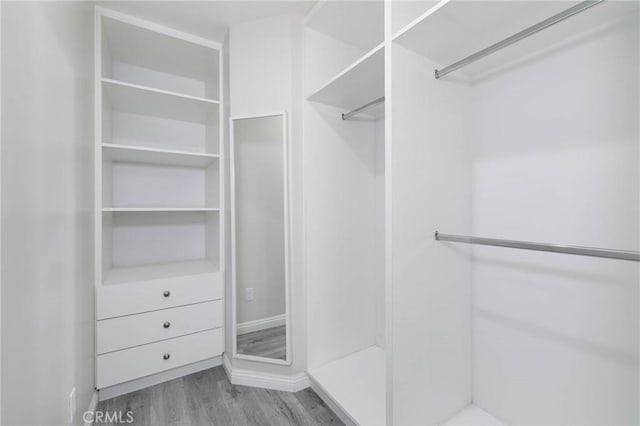 23064 Paseo De Terrado Unit 2, Diamond Bar, CA 91765 - walk in closet featuring wood finished floors