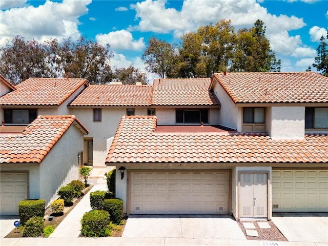 23064 Paseo De Terrado Unit 2, Diamond Bar, CA 91765 - mediterranean / spanish-style home with concrete driveway, stucco siding, and a tiled roof