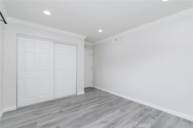 23064 Paseo De Terrado Unit 2, Diamond Bar, CA 91765 - unfurnished bedroom featuring wood finished floors, baseboards, recessed lighting, crown molding, and a closet