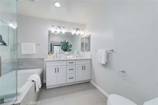23064 Paseo De Terrado Unit 2, Diamond Bar, CA 91765 - bathroom featuring a bathtub, toilet, double vanity, tile patterned floors, and baseboards