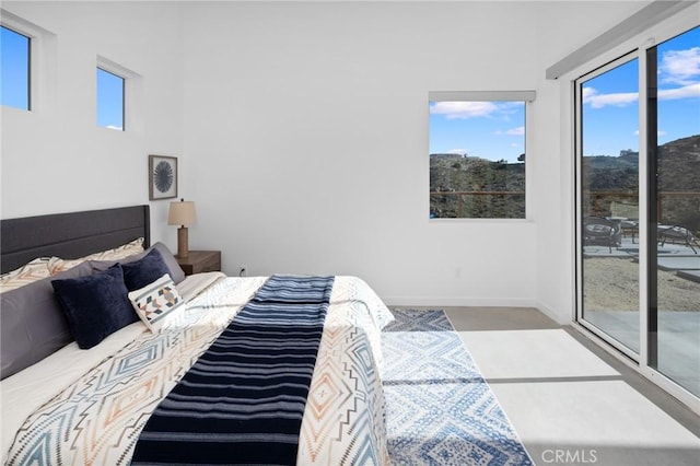 5890 Olema Rd, Yucca Valley, CA 92284 - bedroom with multiple windows and baseboards