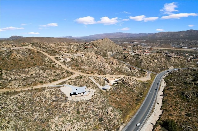 5890 Olema Rd, Yucca Valley, CA 92284 - aerial view of property and surrounding area with a mountain backdrop and a desert landscape