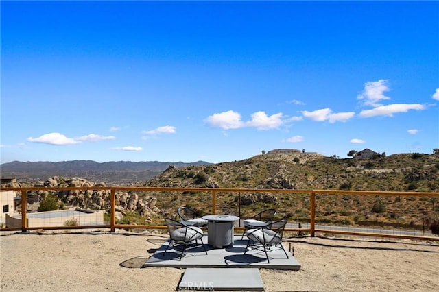 5890 Olema Rd, Yucca Valley, CA 92284 - view of yard with a mountain view and a patio