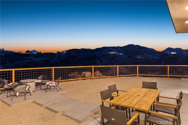 5890 Olema Rd, Yucca Valley, CA 92284 - view of patio / terrace with an outdoor fire pit, a mountain view, and outdoor dining area