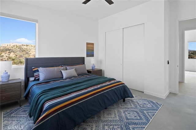 5890 Olema Rd, Yucca Valley, CA 92284 - bedroom with a closet, ceiling fan, baseboards, and carpet flooring