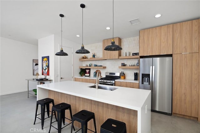 5890 Olema Rd, Yucca Valley, CA 92284 - kitchen with stainless steel appliances, open shelves, a sink, modern cabinets, and finished concrete flooring