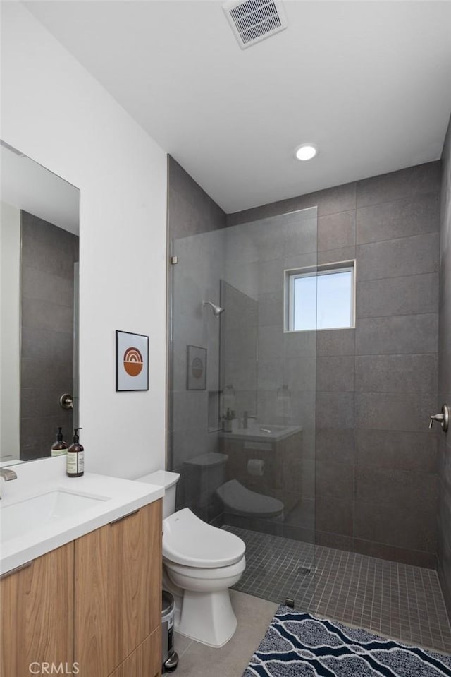 5890 Olema Rd, Yucca Valley, CA 92284 - full bath with tile patterned floors, vanity, walk in shower, toilet, and recessed lighting