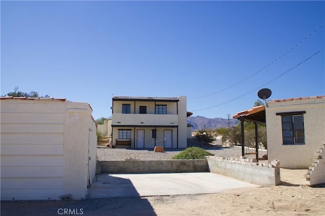73752 Crestview Dr Unit 29, Palms, CA 92277 - back of property with a mountain view and stucco siding