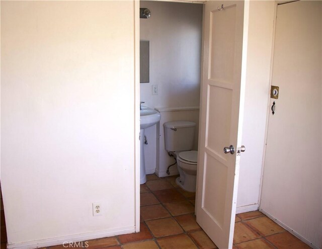 73752 Crestview Dr Unit 29, Palms, CA 92277 - half bathroom featuring toilet, baseboards, and tile patterned floors