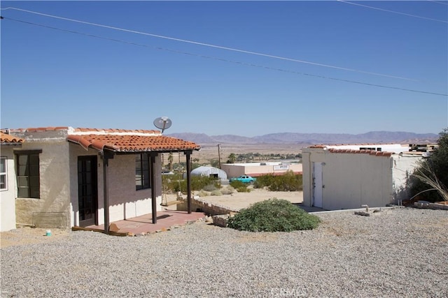 73752 Crestview Dr Unit 29, Palms, CA 92277 - view of yard featuring a mountain view and a patio area