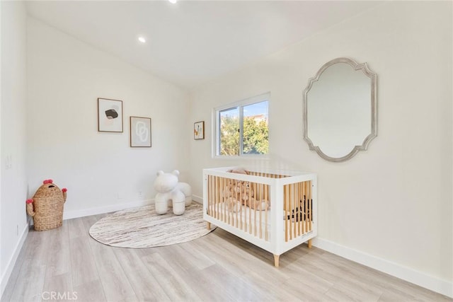 2563 Pepperdale Dr, Rowland Heights, CA 91748 - bedroom featuring wood finished floors, a nursery area, baseboards, vaulted ceiling, and recessed lighting