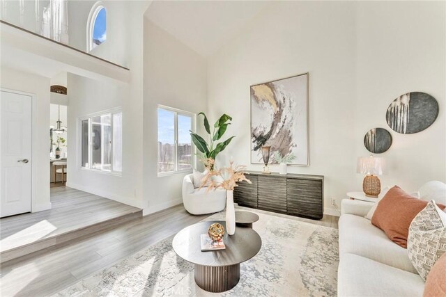 2563 Pepperdale Dr, Rowland Heights, CA 91748 - living area featuring high vaulted ceiling, wood finished floors, and baseboards