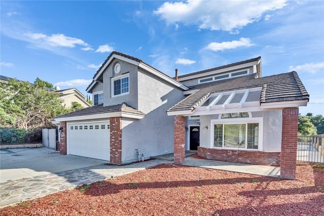 2563 Pepperdale Dr, Rowland Heights, CA 91748 - traditional-style home featuring stucco siding, brick siding, driveway, a tiled roof, and an attached garage