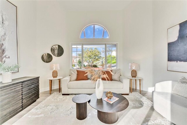 2563 Pepperdale Dr, Rowland Heights, CA 91748 - living area with wood finished floors, a high ceiling, and baseboards