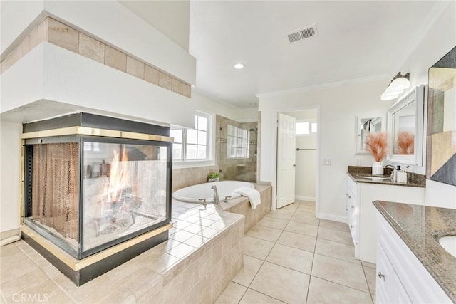 2563 Pepperdale Dr, Rowland Heights, CA 91748 - bathroom with two vanities, a garden tub, crown molding, tile patterned floors, and tiled shower
