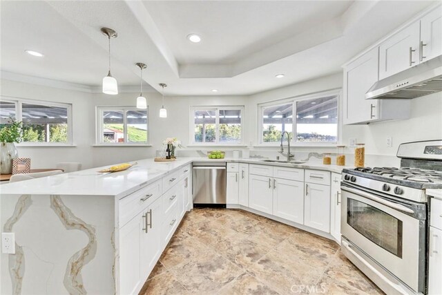 2563 Pepperdale Dr, Rowland Heights, CA 91748 - kitchen with stainless steel appliances, a sink, under cabinet range hood, healthy amount of natural light, and recessed lighting