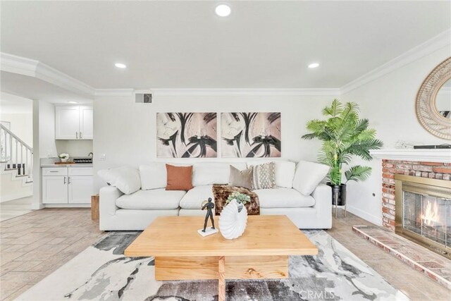 2563 Pepperdale Dr, Rowland Heights, CA 91748 - living room featuring ornamental molding, stairway, recessed lighting, a brick fireplace, and baseboards