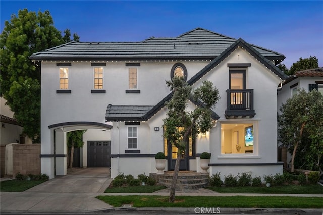 5 Modesto, Irvine, CA 92602 - view of front facade with an attached garage, stucco siding, concrete driveway, and a tiled roof