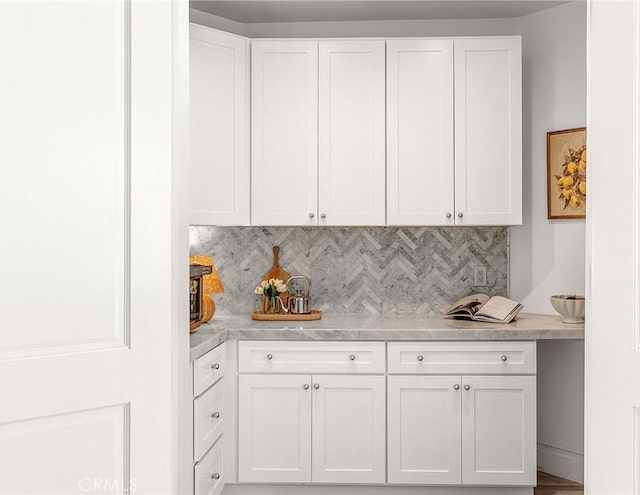 5 Modesto, Irvine, CA 92602 - kitchen featuring white cabinetry, light countertops, and decorative backsplash