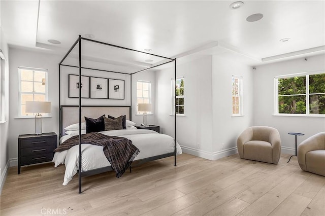 5 Modesto, Irvine, CA 92602 - bedroom featuring baseboards, multiple windows, and light wood-style flooring