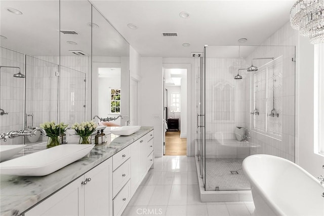 5 Modesto, Irvine, CA 92602 - bathroom featuring a freestanding bath, a shower stall, double vanity, tile patterned flooring, and recessed lighting