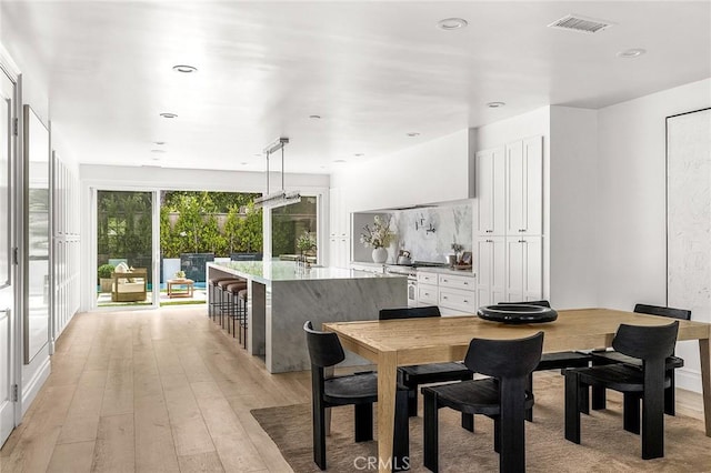 5 Modesto, Irvine, CA 92602 - dining area featuring light wood-style floors and recessed lighting