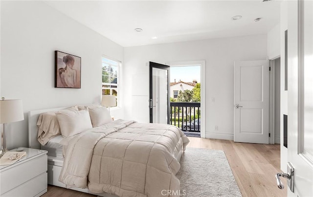 5 Modesto, Irvine, CA 92602 - bedroom featuring access to exterior, light wood-style floors, and recessed lighting