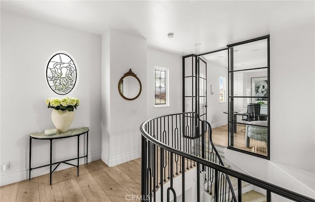 5 Modesto, Irvine, CA 92602 - hallway featuring an upstairs landing, light wood-type flooring, and baseboards