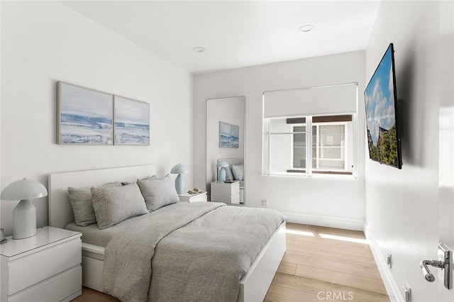 5 Modesto, Irvine, CA 92602 - bedroom featuring light wood-type flooring and baseboards
