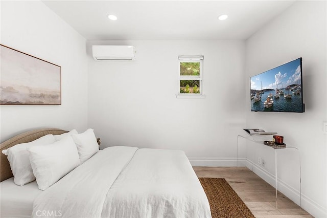 5 Modesto, Irvine, CA 92602 - bedroom with a wall unit AC, light wood finished floors, baseboards, and recessed lighting