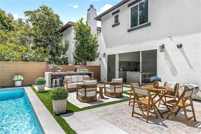 5 Modesto, Irvine, CA 92602 - back of house with stucco siding, an outdoor hangout area, a patio, and a chimney