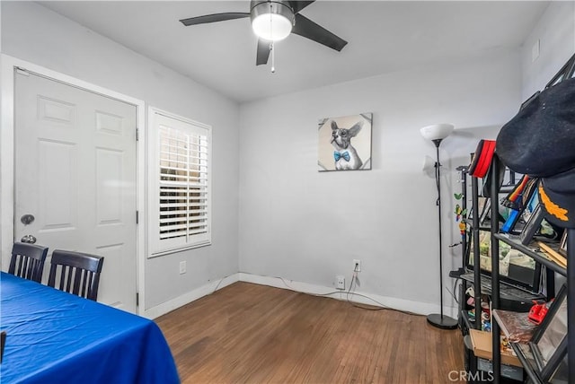 7726 Dalton Ave, Los Angeles, CA 90047 - unfurnished bedroom featuring wood finished floors, baseboards, and ceiling fan