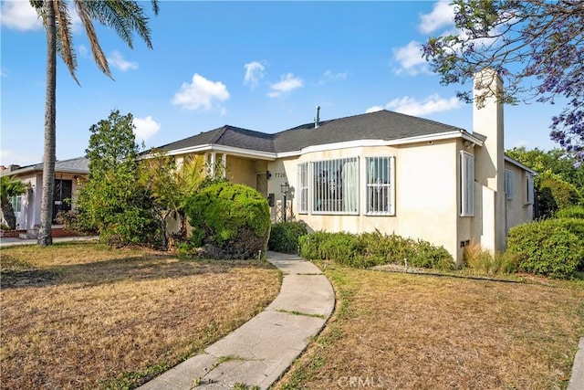 7726 Dalton Ave, Los Angeles, CA 90047 - bungalow-style house with stucco siding, a chimney, and a front lawn