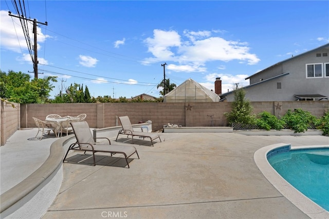 16762 Madrone Cir, Fountain Valley, CA 92708 - view of swimming pool with a patio area, a fenced backyard, and outdoor dining space