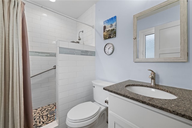 16762 Madrone Cir, Fountain Valley, CA 92708 - bathroom featuring vanity, toilet, and a tile shower