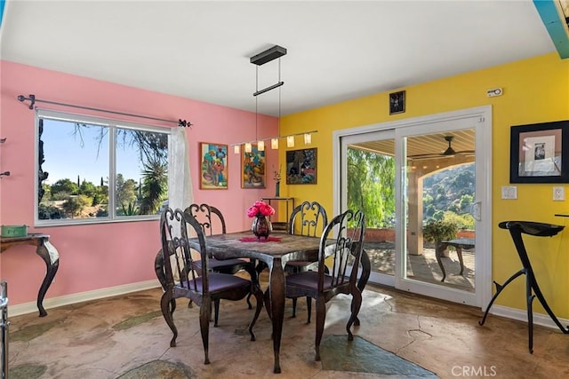 801 Box Canyon Rd, Canoga Park, CA 91304 - dining space with baseboards and concrete floors