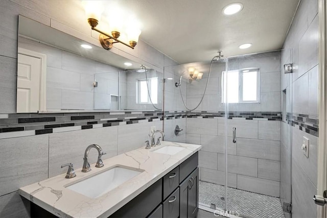 15510 Midcrest Dr, Whittier, CA 90604 - full bath featuring a shower stall, double vanity, tile walls, and recessed lighting