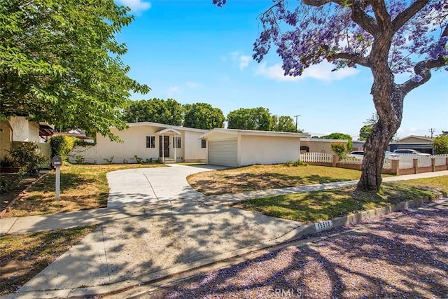 15510 Midcrest Dr, Whittier, CA 90604 - view of front of property featuring stucco siding, concrete driveway, and an attached garage