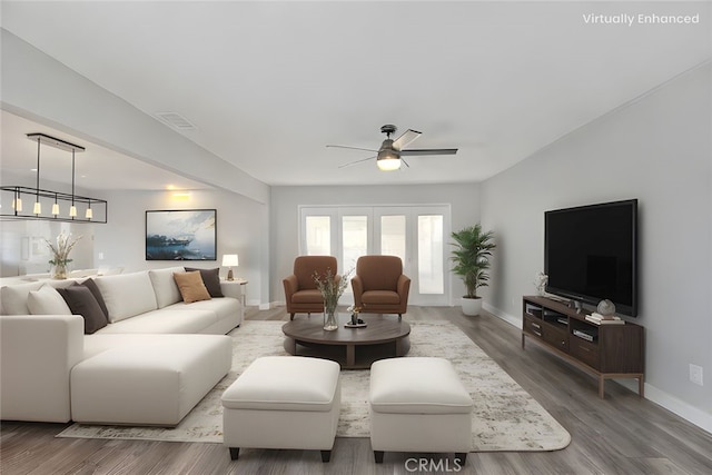 7747 Onyx Ave, Rancho Cucamonga, CA 91730 - living area featuring ceiling fan, baseboards, and wood finished floors
