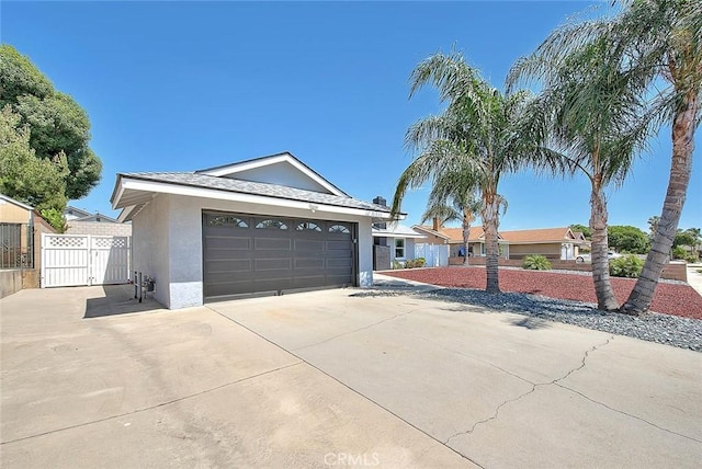7747 Onyx Ave, Rancho Cucamonga, CA 91730 - ranch-style house featuring stucco siding, concrete driveway, an attached garage, and a gate