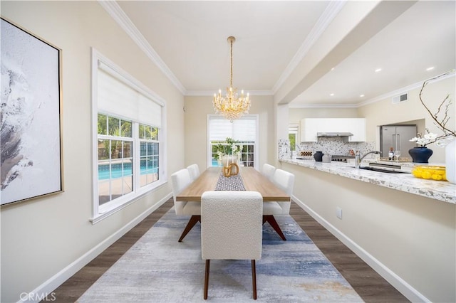 2122 Meteora Way, Rowland Heights, CA 91748 - dining area with a chandelier, dark wood-style flooring, crown molding, and recessed lighting