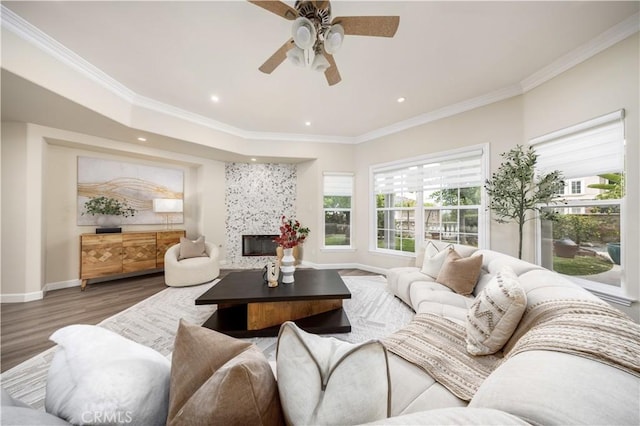2122 Meteora Way, Rowland Heights, CA 91748 - living room with wood finished floors, a premium fireplace, ceiling fan, baseboards, and crown molding