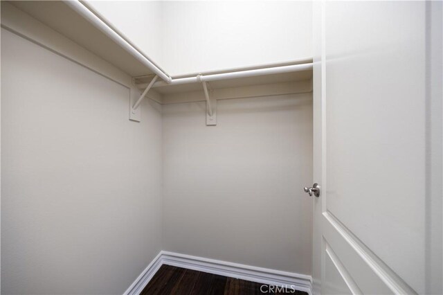 2122 Meteora Way, Rowland Heights, CA 91748 - walk in closet with dark wood-style flooring