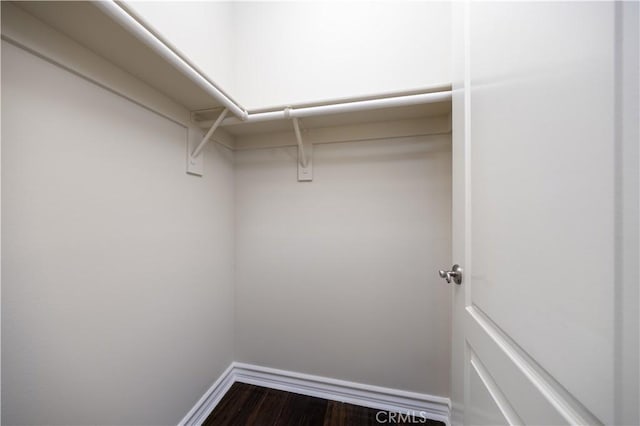 2122 Meteora Way, Rowland Heights, CA 91748 - spacious closet featuring dark wood finished floors